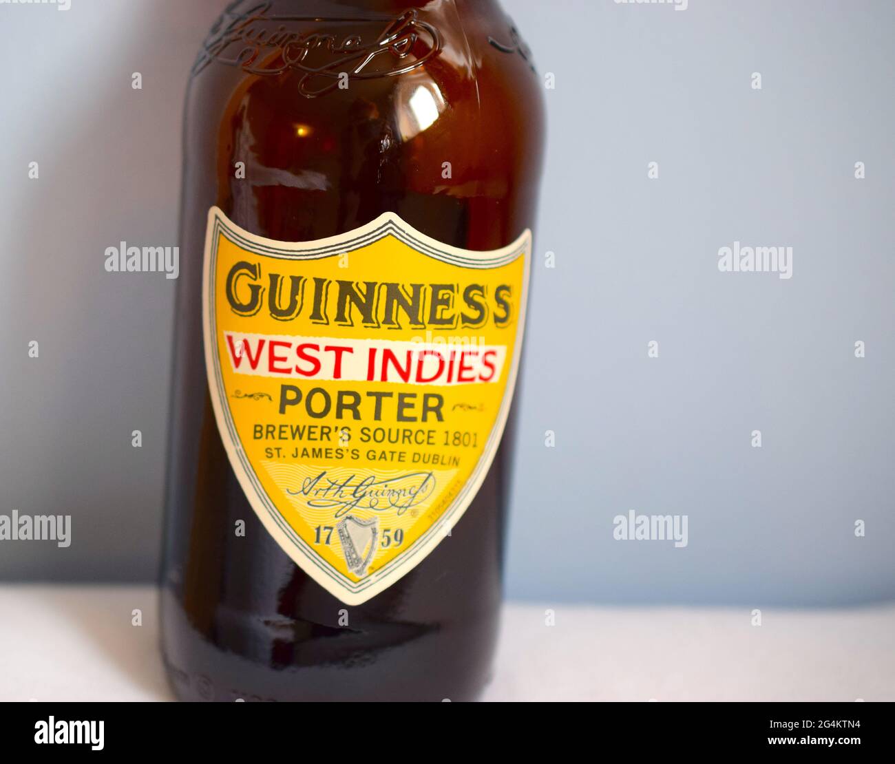 Guinness porter bottle on grey background Stock Photo Alamy