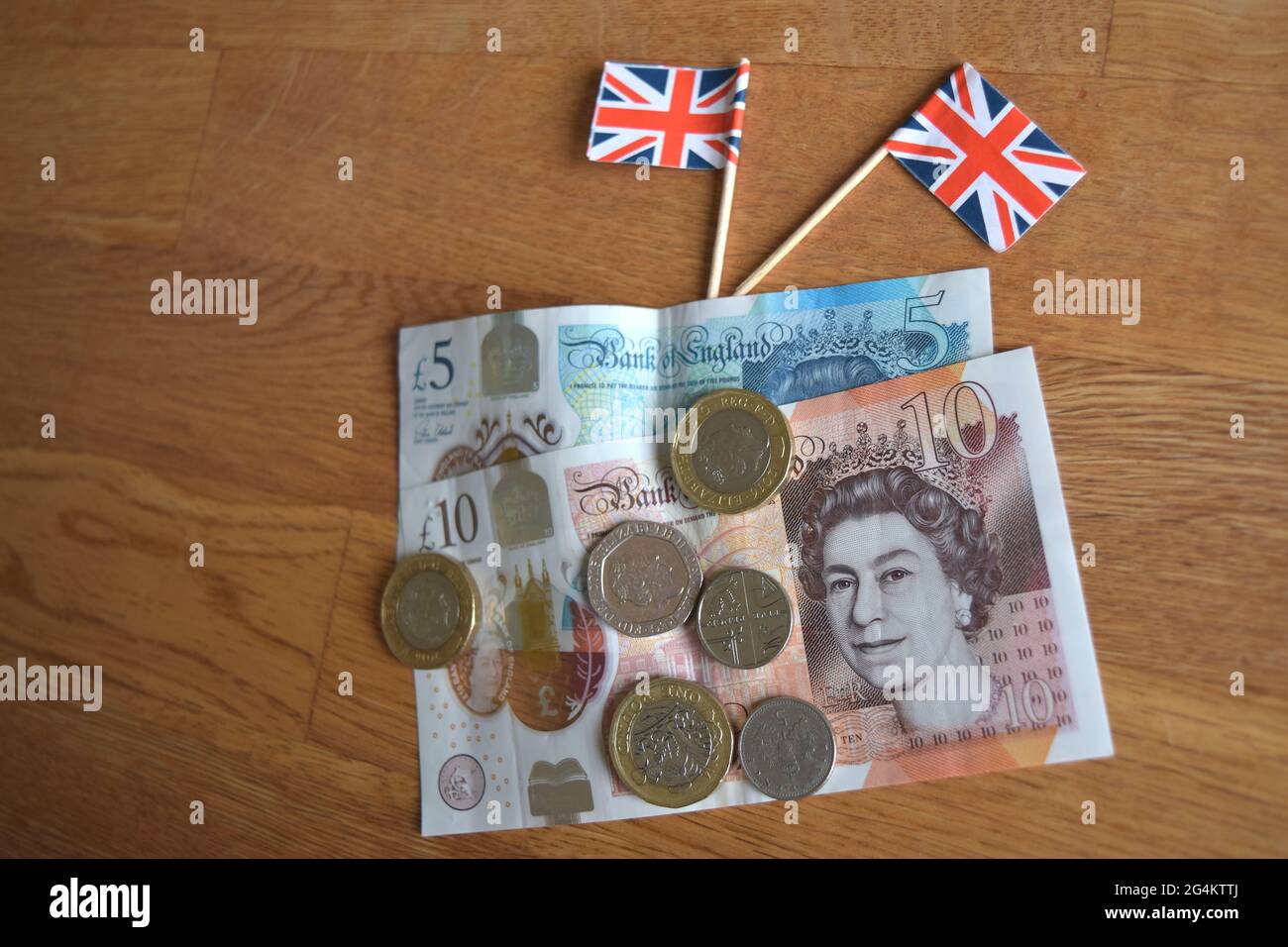 British coins and banknotes with small flags Stock Photo - Alamy