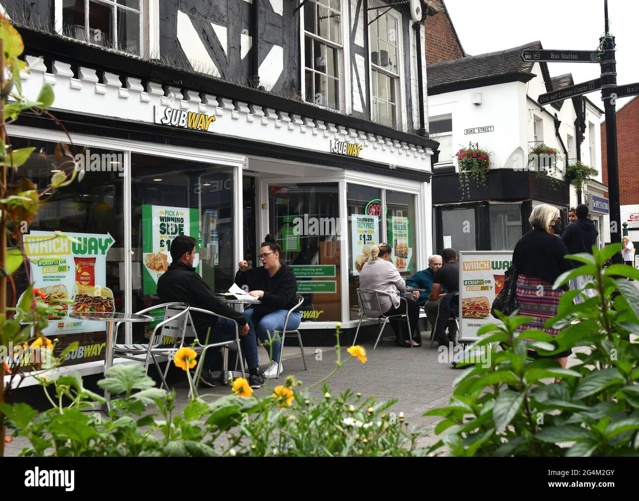 People dining outside Subway cafe restaurant in Wellington Shropshire Stock Photo