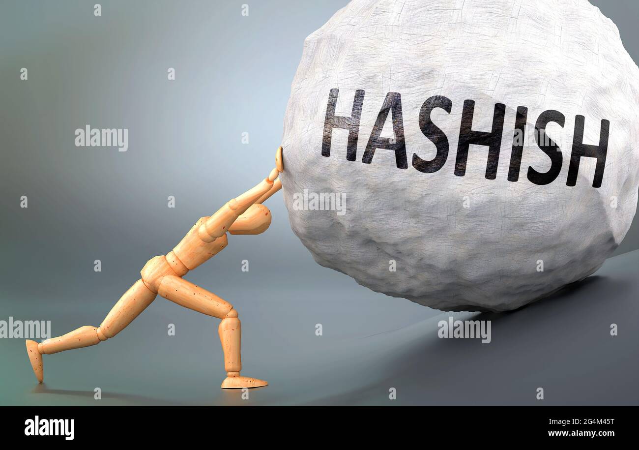 Hashish and painful human condition, pictured as a wooden human figure pushing heavy weight to show how hard it can be to deal with Hashish in human l Stock Photo