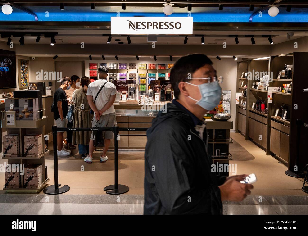 A man walks past the Swiss highend and world leader in coffee capsules