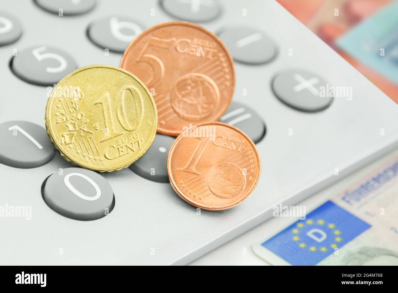Calculator and 16 Cent Euro with German driving licence Stock Photo