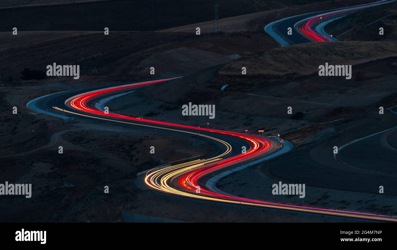 Winding road night hi-res stock photography and images - Alamy