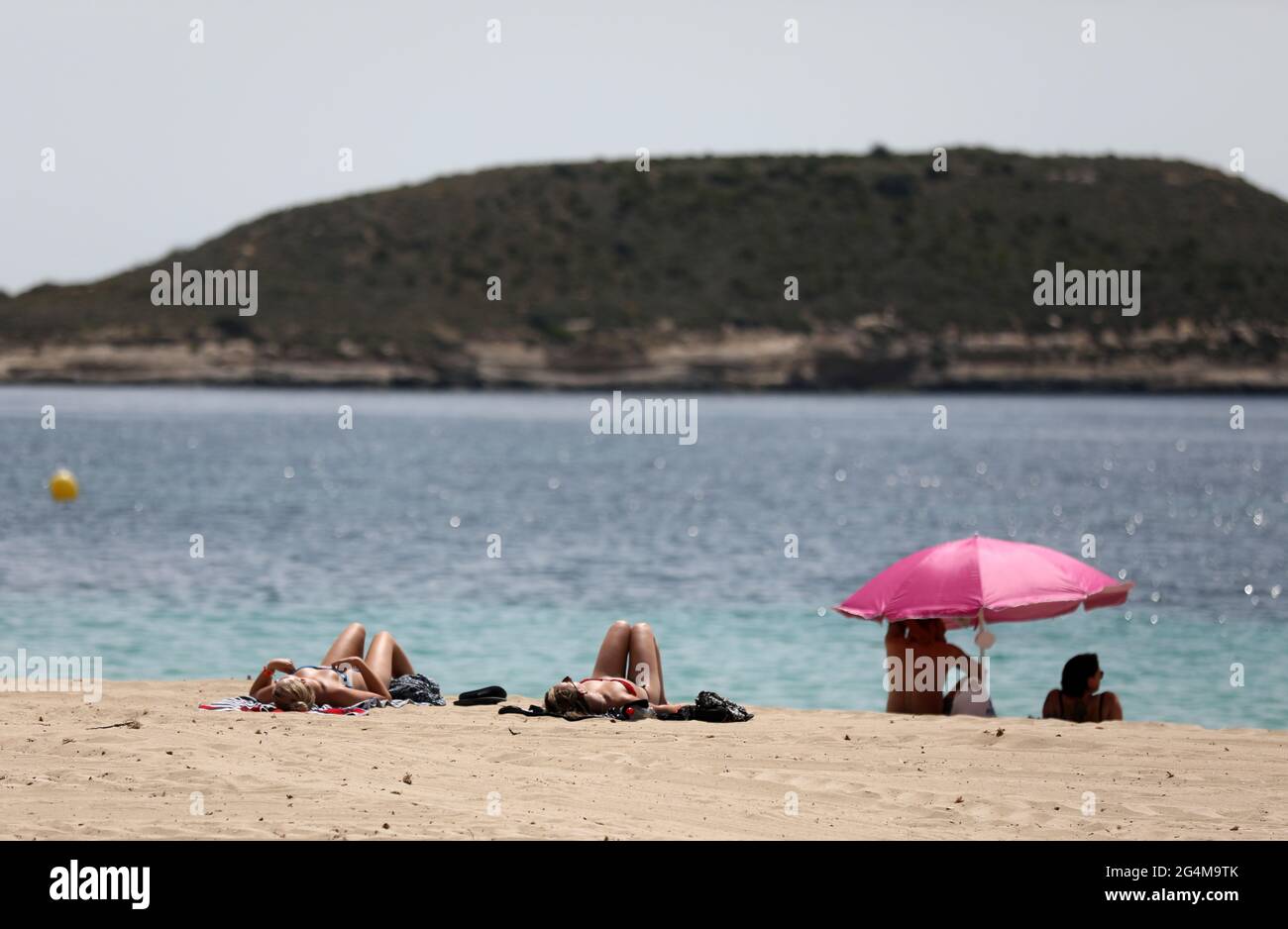 Sunbathers in Magaluf beach, Mallorca, Spain, as the Balearic islands of Ibiza, Majorca and Menorca are on the cusp of being added to UK green list. Stock Photo