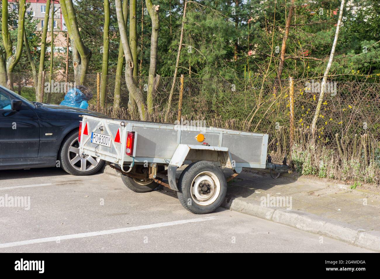 POZNAN, POLAND Apr 04, 2016 Small two wheeled car cart standing on a parking lot Stock Photo