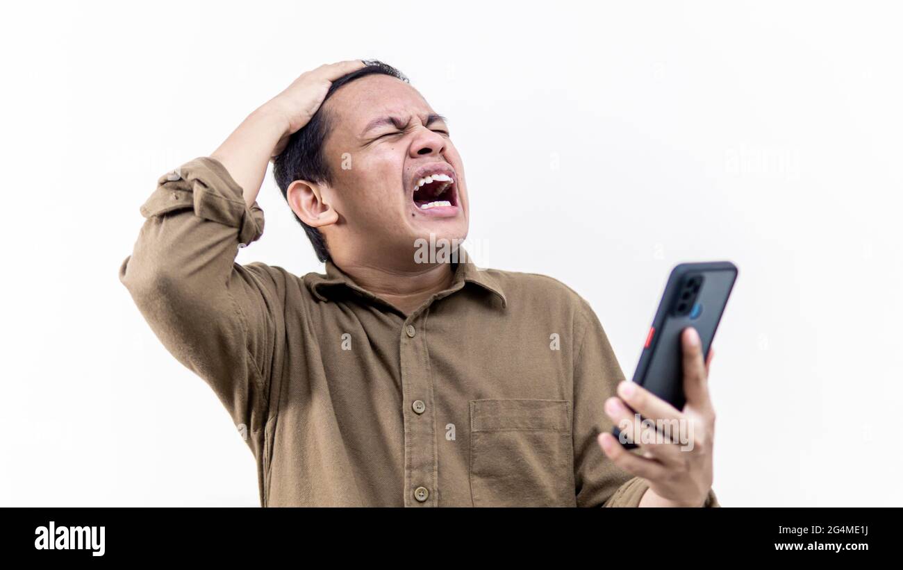 Asian Malay Man Working With Laptop While Using The Phone Stock Photo Image Of Female Kitchen 147725474