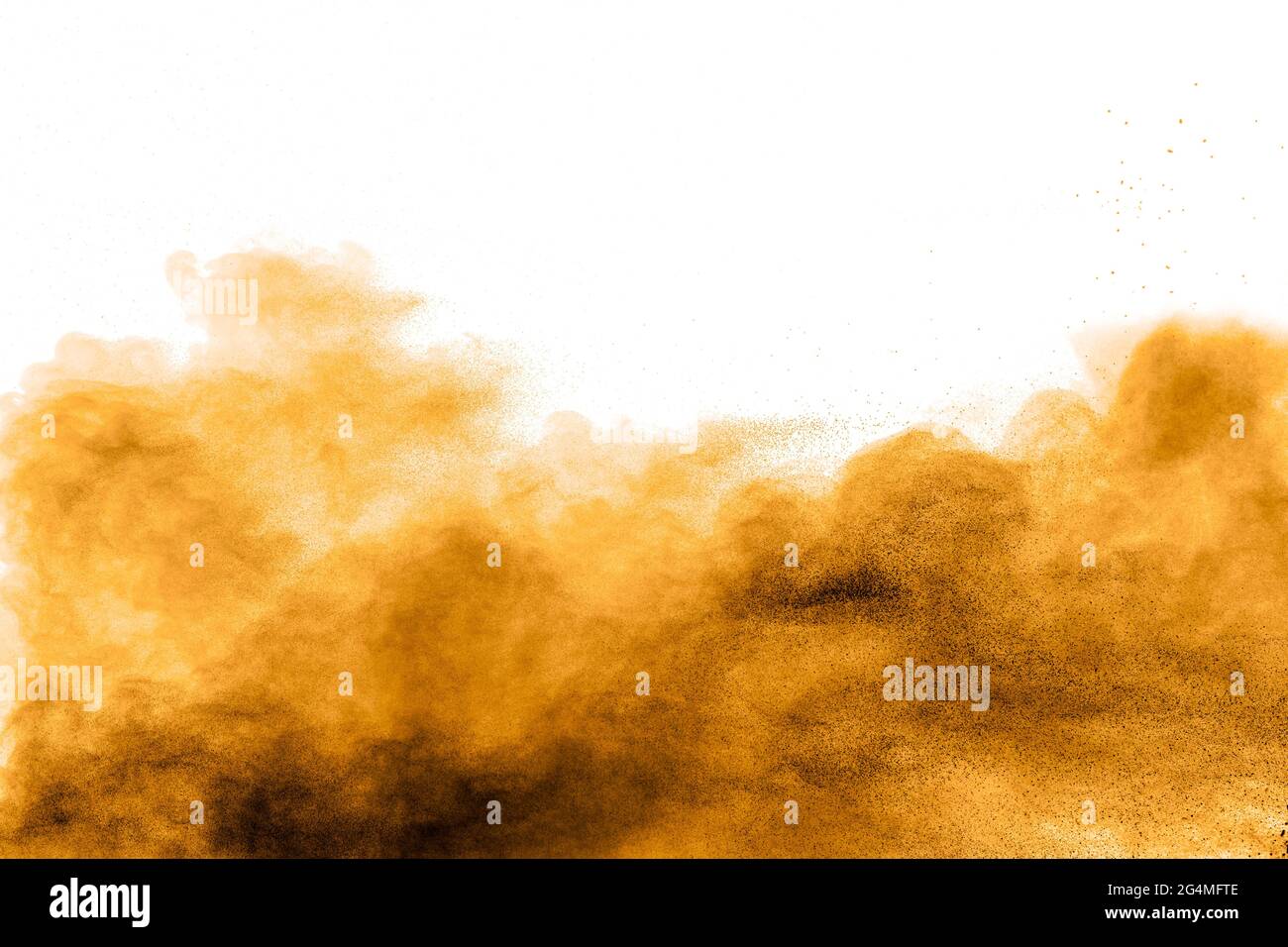 Freeze motion of brown dust explosion on white background.Stopping the movement of brown Holi powder. Stock Photo