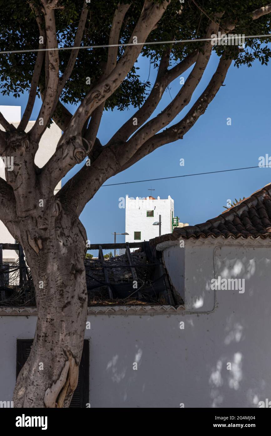 Castellated tower of the Casa Fuerte seen over rooftops in Adeje, Tenerife, Canary Islands, Spain Stock Photo