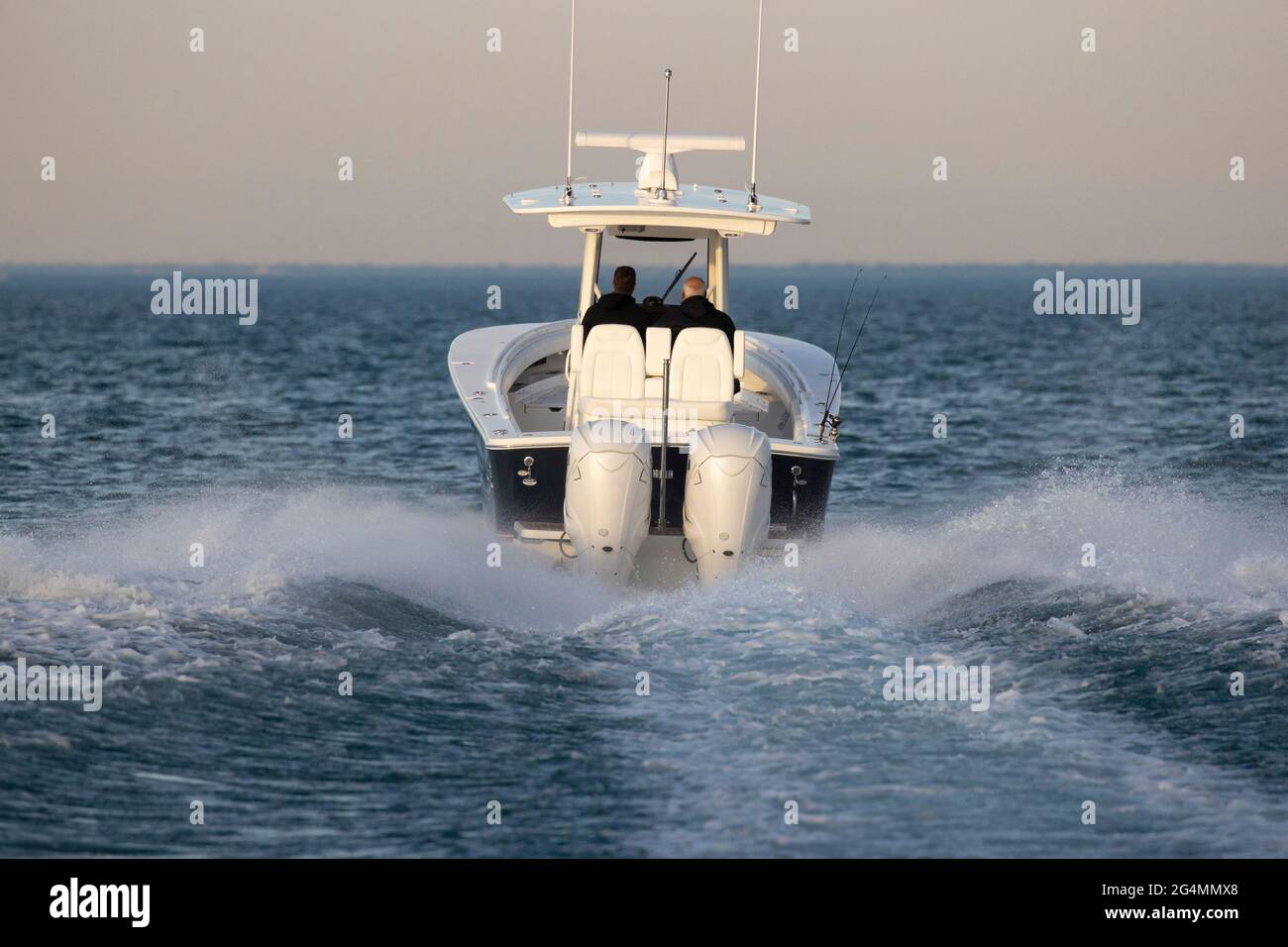 A center console boat speeding away on an empty lake. Stock Photo