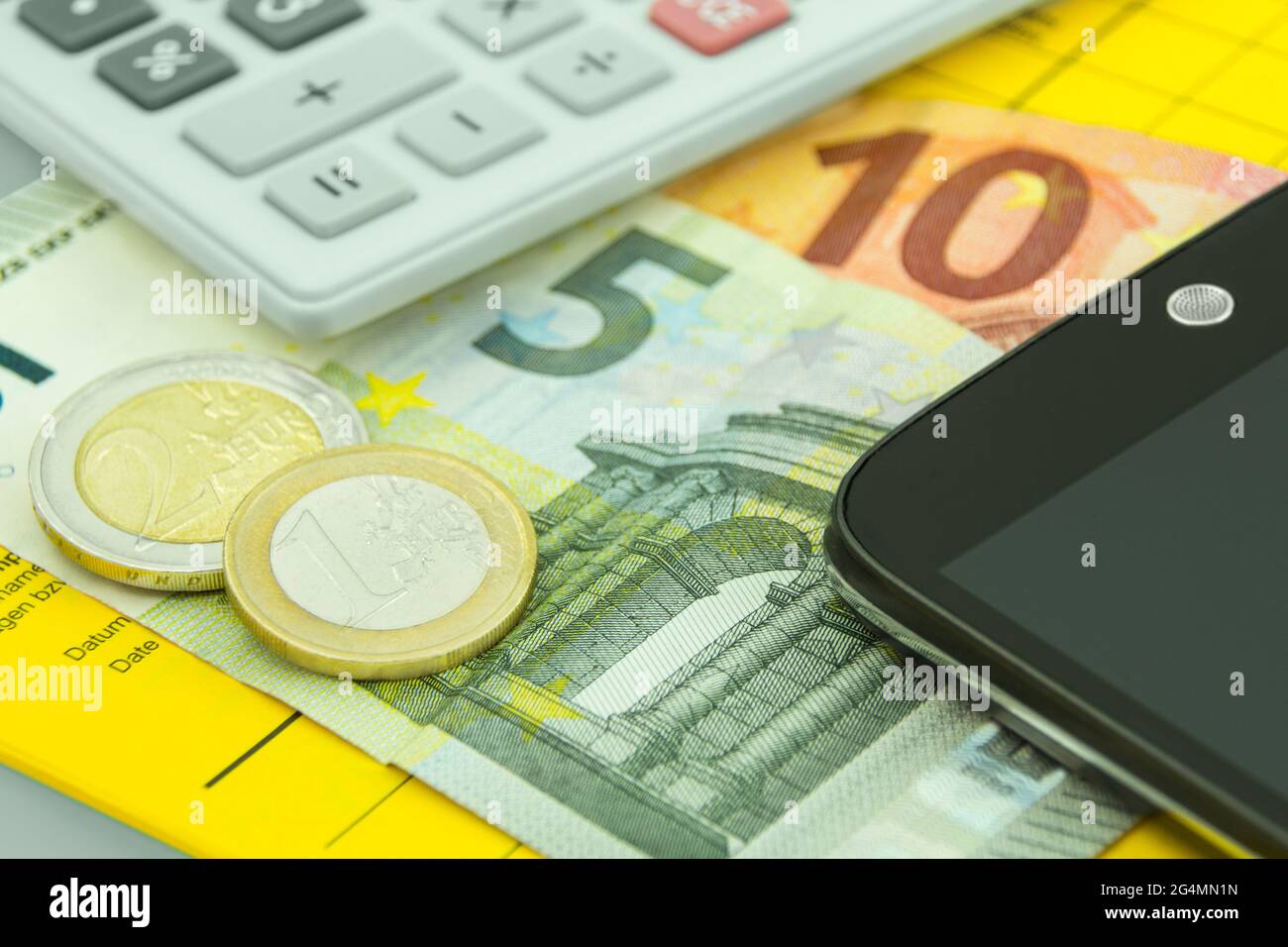 Vaccination certificate and mobile and 18 Euro Stock Photo