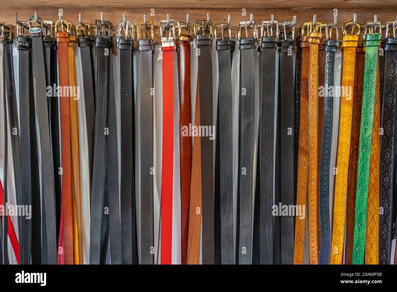Handmade leather belts by a leather craftsman displayed for sale. Isernia, Molise, Italy, Europe Stock Photo