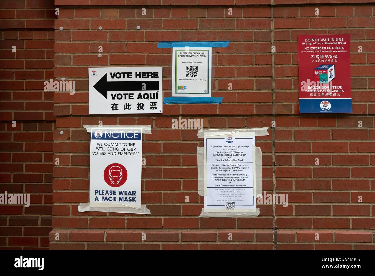 Signs outside a polling place on Primary Election Day in New York City were written in English, Spanish and Chinese. June 22, 2021 Stock Photo