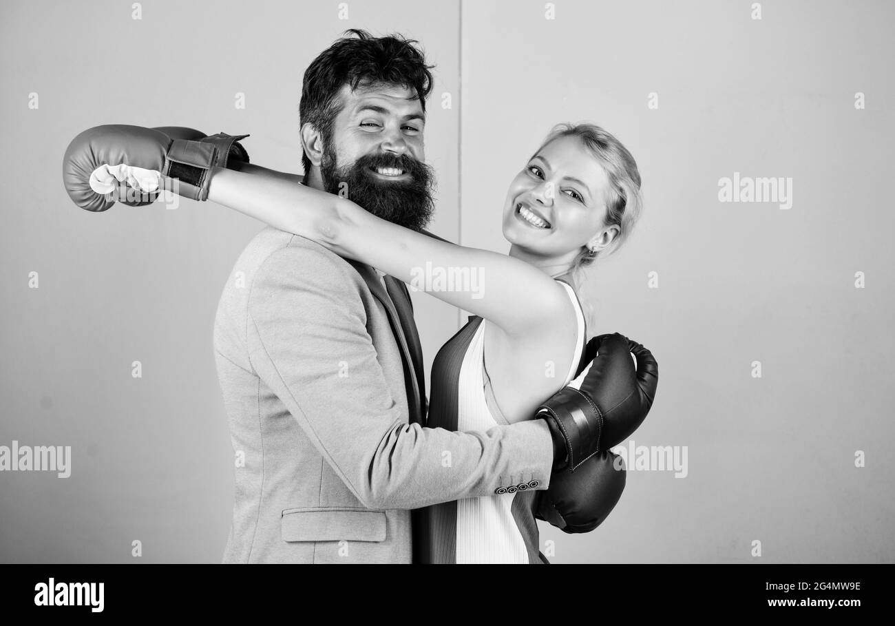 Difficult relationships. Couple in love competing boxing. Conflict concept. Family life. Boxers fighting gloves. Man and woman boxing fight Stock Photo