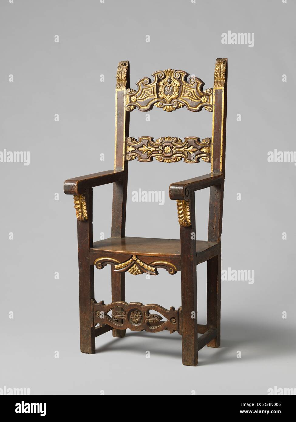 Armchair. Armchair from walnut, partially plated. The front legs end as a struts, which are decorated at the top of leaf consoles, and supports the armrests, ending in volutes. The most outward prosposal, preside and back sports are decorated with, among other things, browse motifs, rosettes and volutes. The back styles, awarded with leaf motifs, tilting backwards. The upper sport of the back carries a coat of arms with flowers, bullets and star. The legs are square. See also BK-16646-B / D. Stock Photo