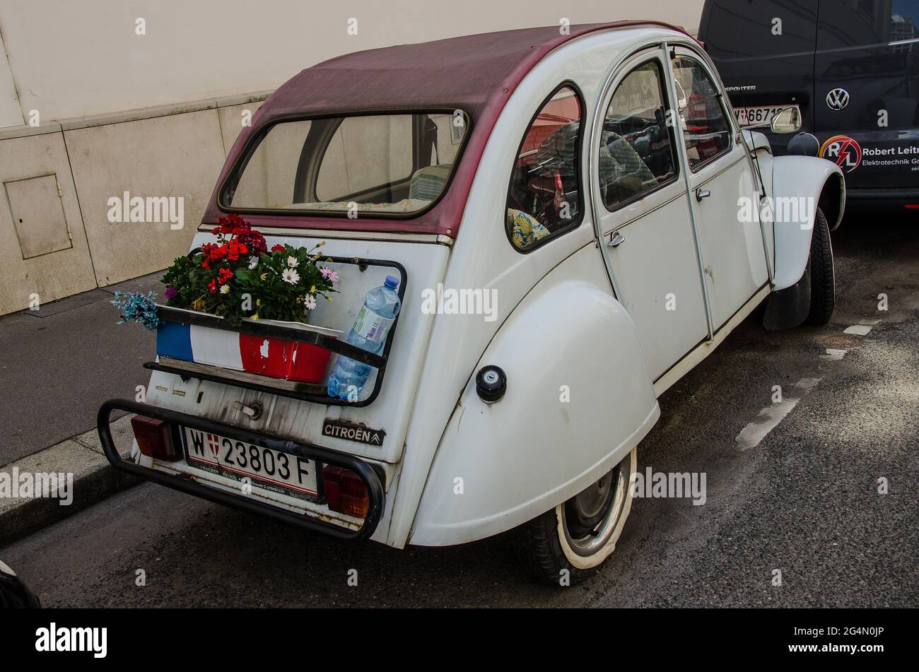 Citroën 2CV or deux chevaux or deux chevaux-vapeur, lit. 'two steam horses', is an air-cooled front-engine, front-wheel-drive, economy family car. Stock Photo