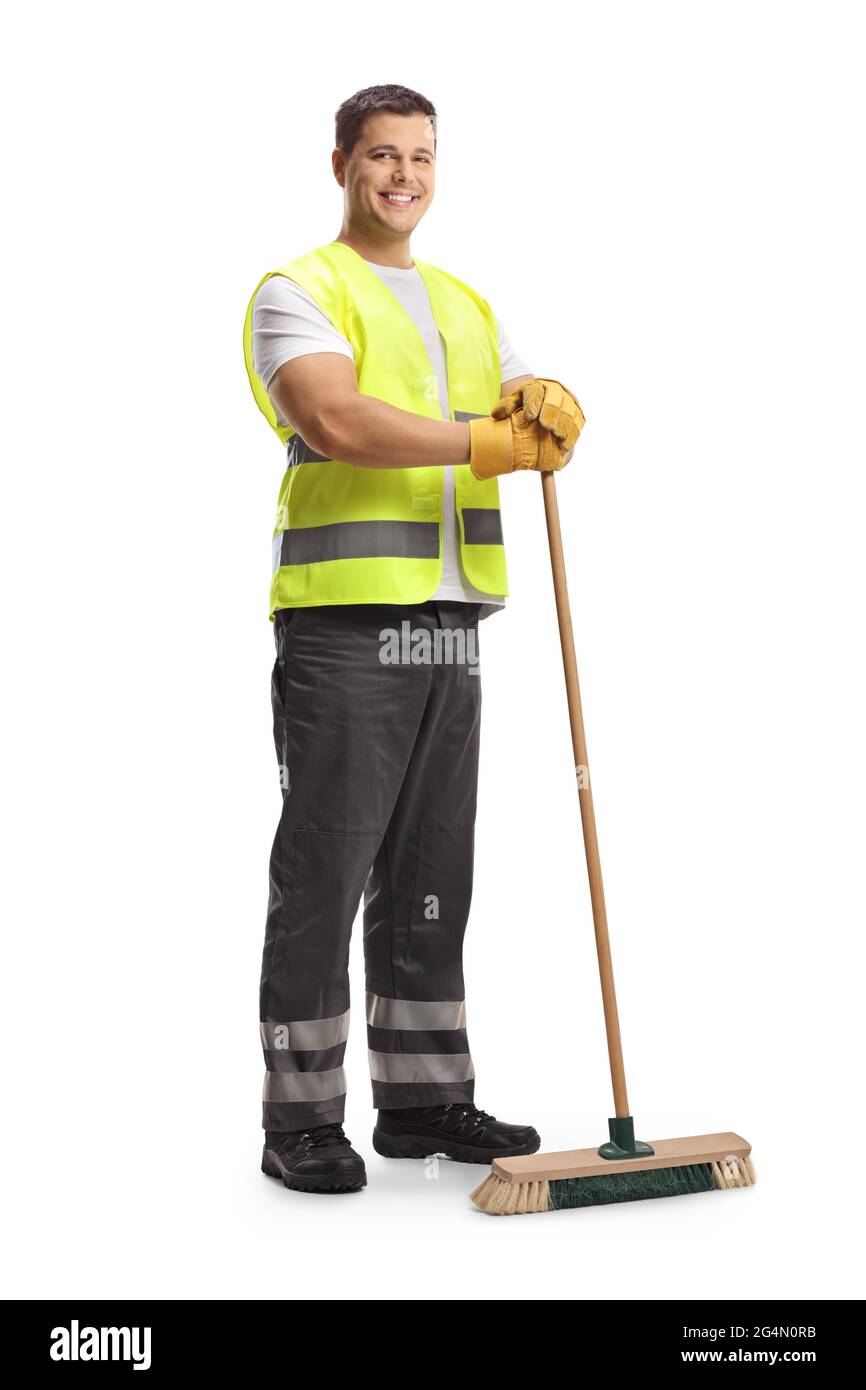 Full length portrait of a young male cleaner in a uniform holding a