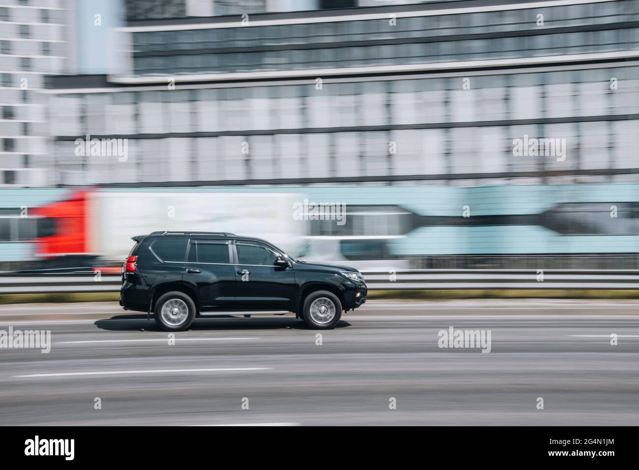 Ukraine, Kyiv - 29 April 2021: Black Toyota Land Cruiser Prado car moving on the street. Editorial Stock Photo