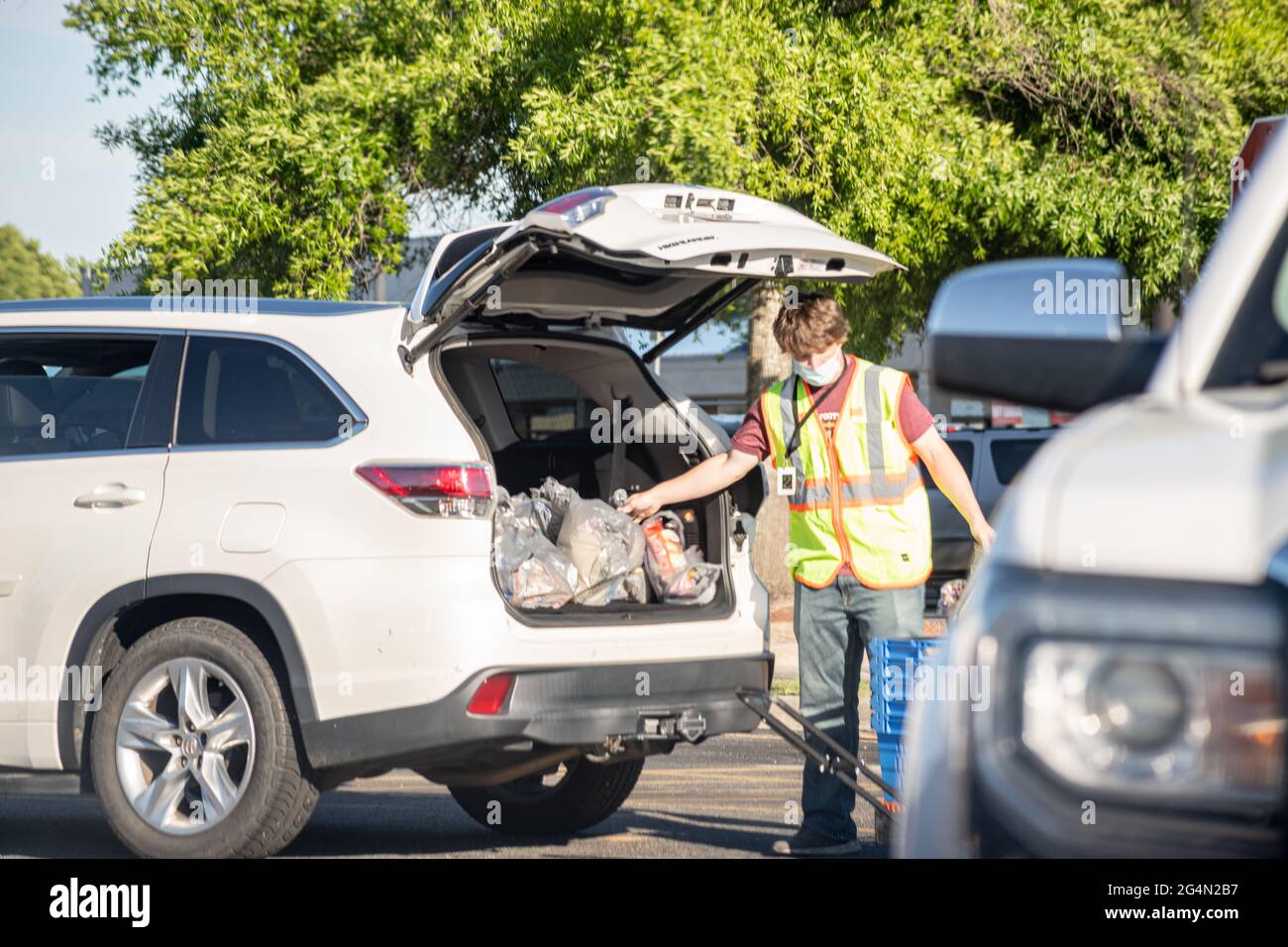 Vidalia, USA May 6, 2021 A Walmart employee loads grocery