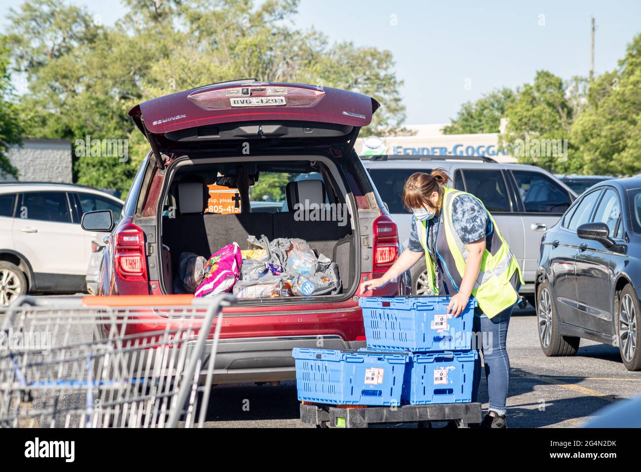 Vidalia, USA May 6, 2021 A Walmart employee loads grocery