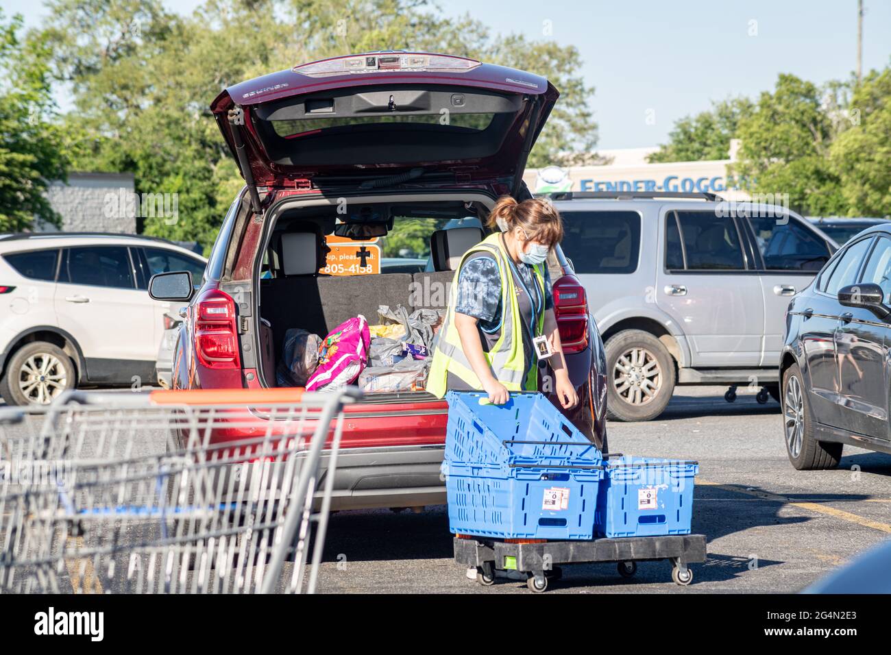 Vidalia, USA May 6, 2021 A Walmart employee loads grocery