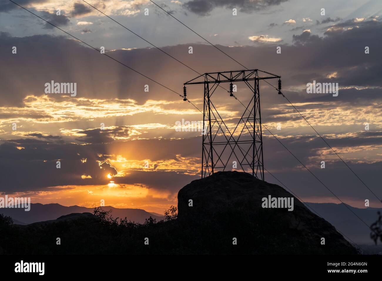 Electric power pylon sunrise at Santa Susana Pass State Historic Park in Los Angeles County, California. Stock Photo