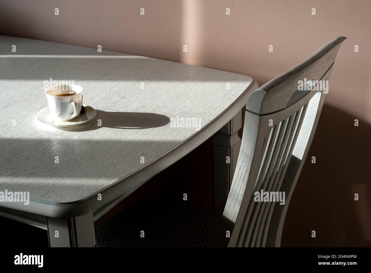 abstract kitchen table and chair design with hard shadows Stock Photo