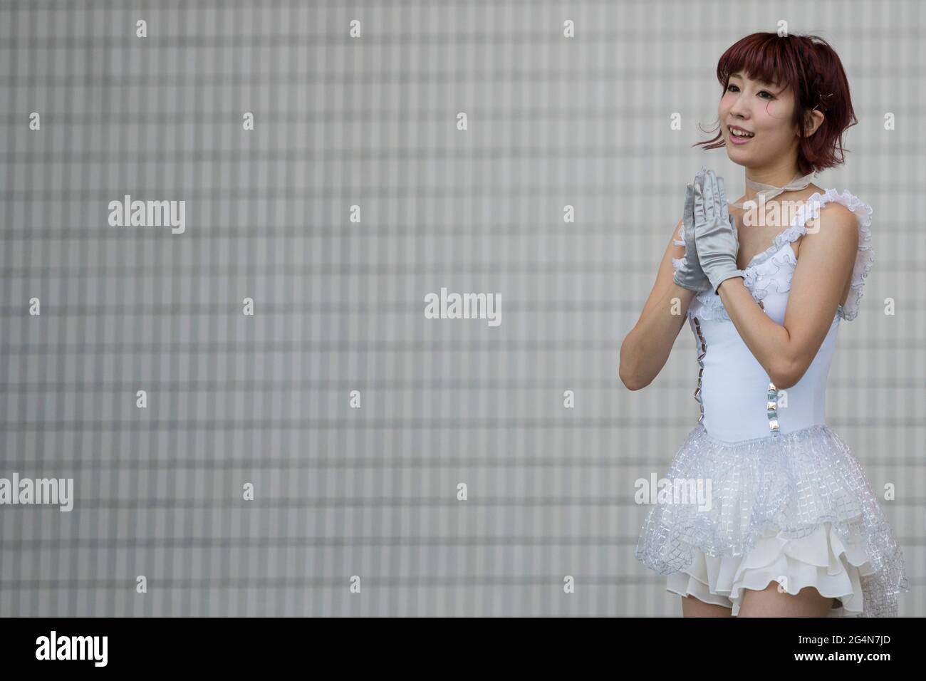 A Japanese singer performing on stage outdoors in Tokyo, Japan Stock