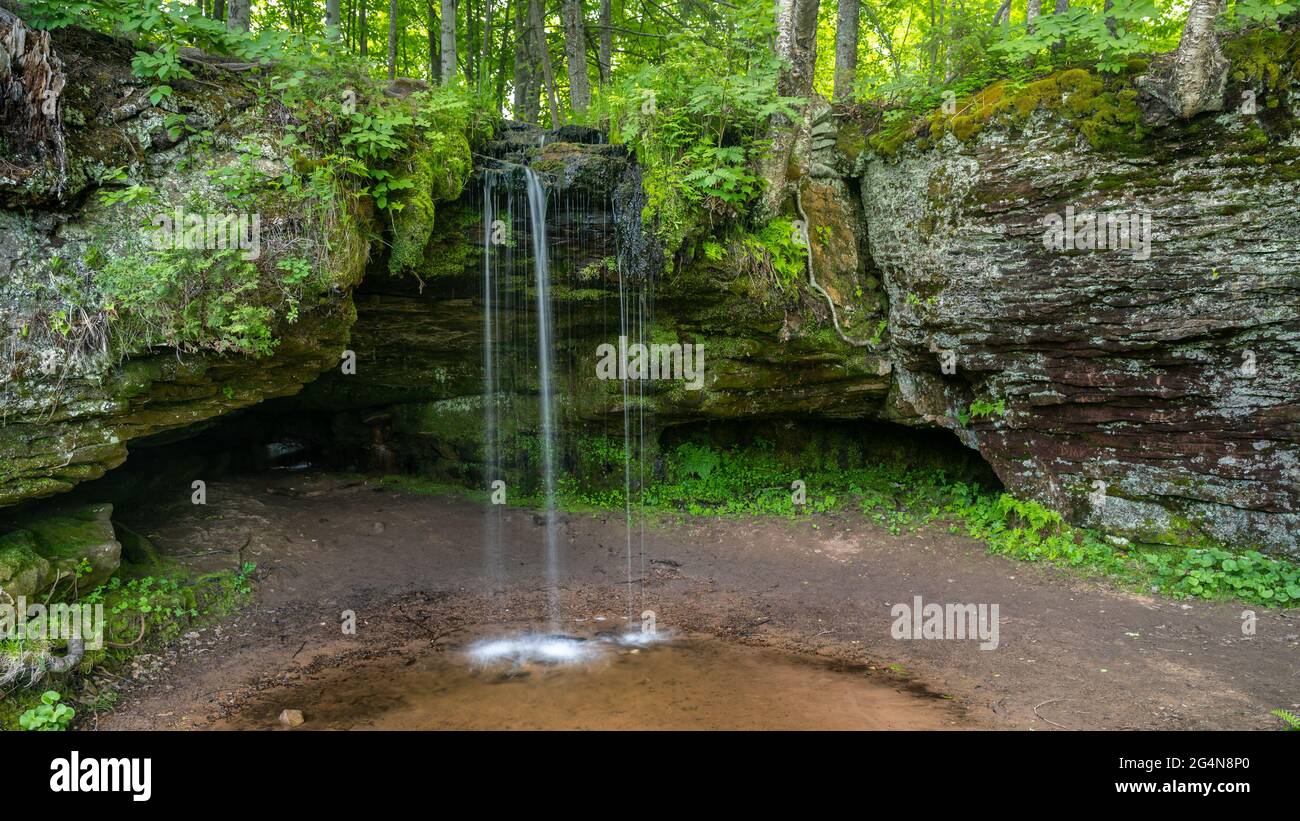 Scott Falls drops about 10 feet over a sandstone cliff into a small pool, in Munising, Michigan Stock Photo