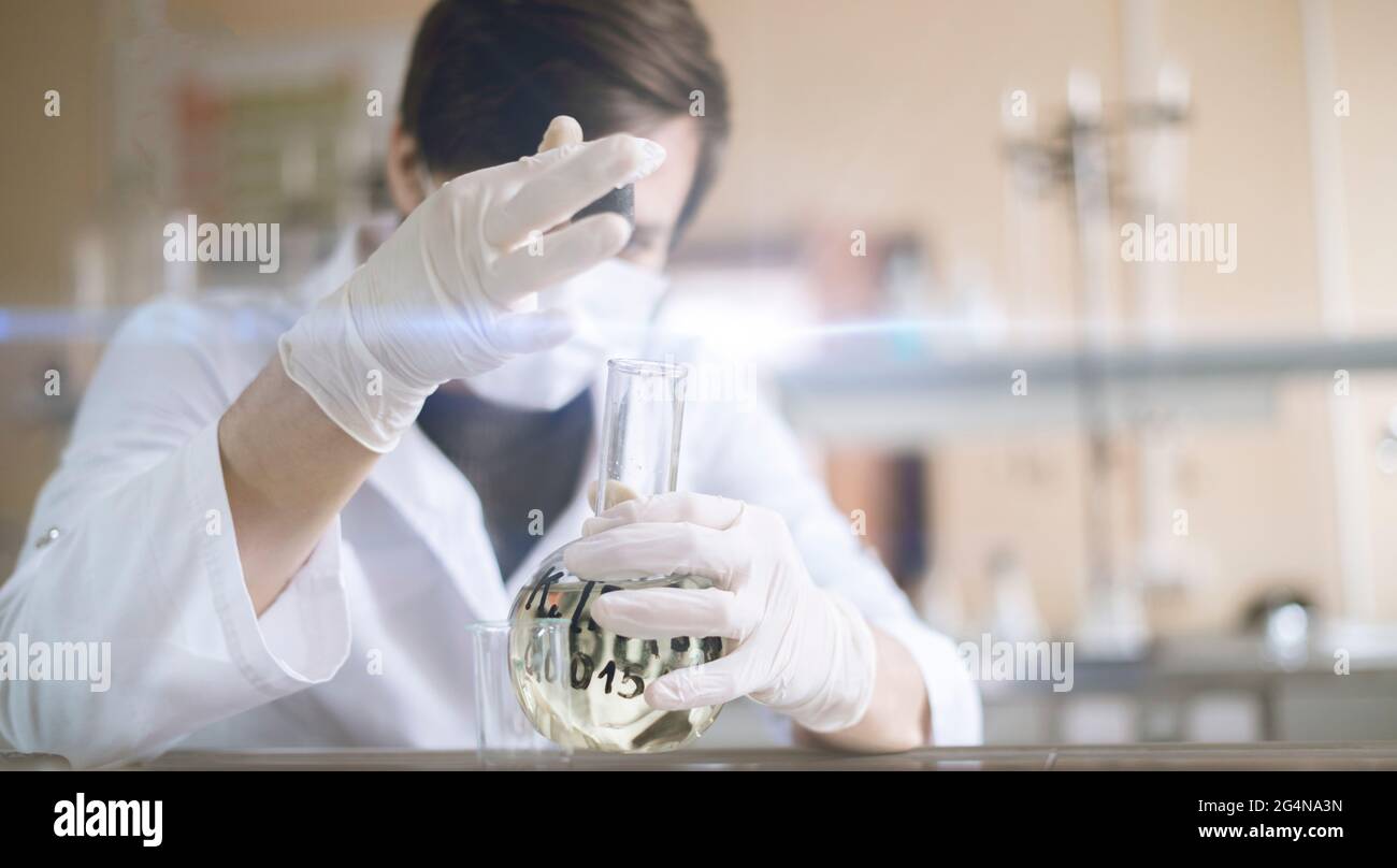 Chemistry class student doing experiment hi-res stock photography and ...