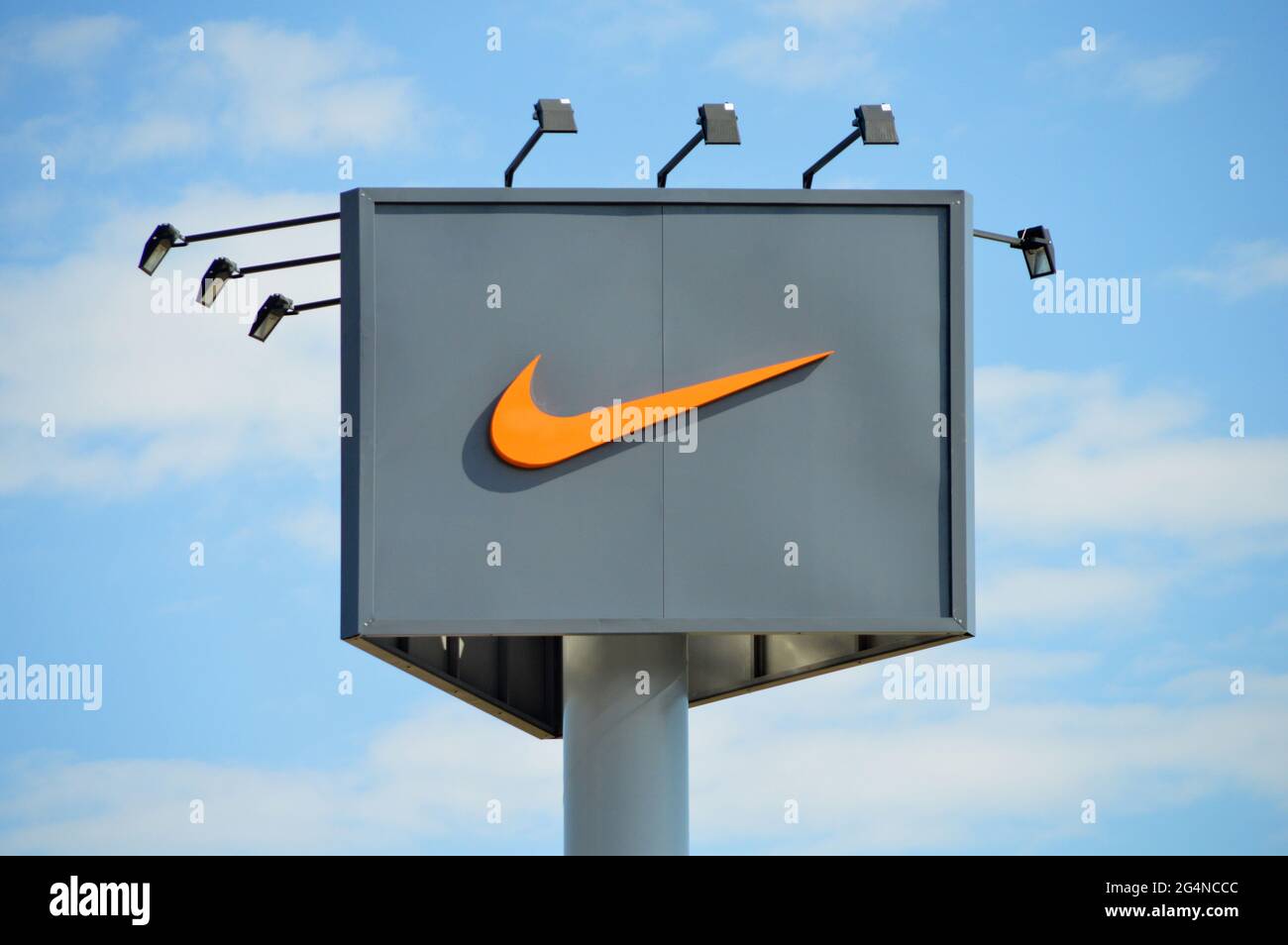 Nike symbol, strong sports brand, outdoor advertising light billboard on  blue sky, Turkey Antalya october 26 2014 Stock Photo - Alamy