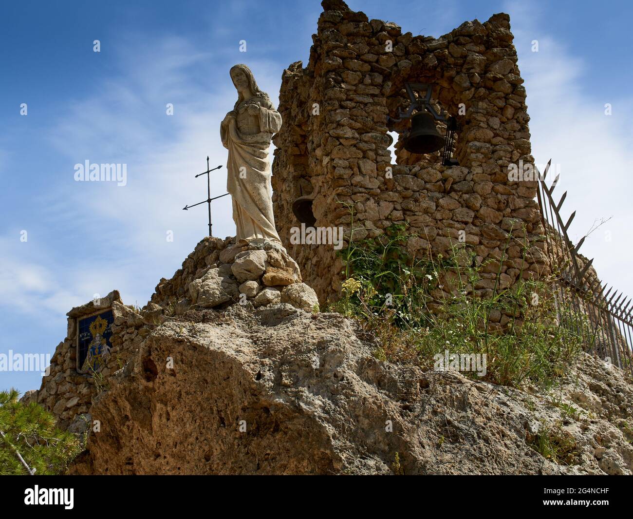 Low angle shot of a statue by the ruins of an old church Stock Photo ...