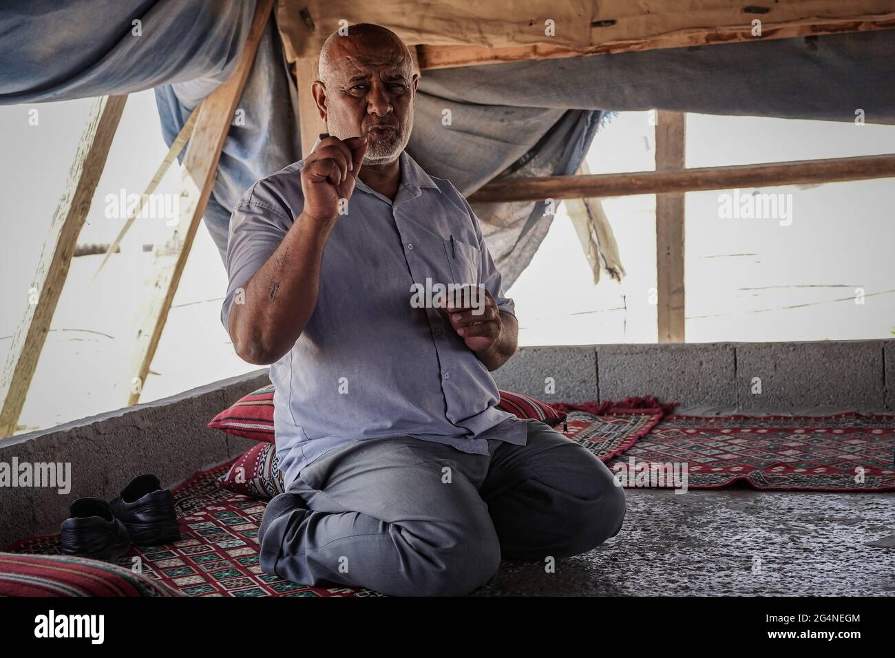 Bir Hadaj, Israel. 22nd, June 2021. ATIEH AL ASAM, Head of the regional Council of the unrecognized villages in the Negev, explains the uncertain future and threat of eviction under which Bedouins live in the unrecognized villages and home demolitions in the legal townships of illegal building. The decades long political battle for the unrecognized Bedouin villages and development of those already legalized in the Israeli Negev climaxes as the new Bennett - Lapid unity government depends on supporting votes from the four Knesset seats belonging to the Raam, United Arab List. Credit: Nir Alon/A Stock Photo
