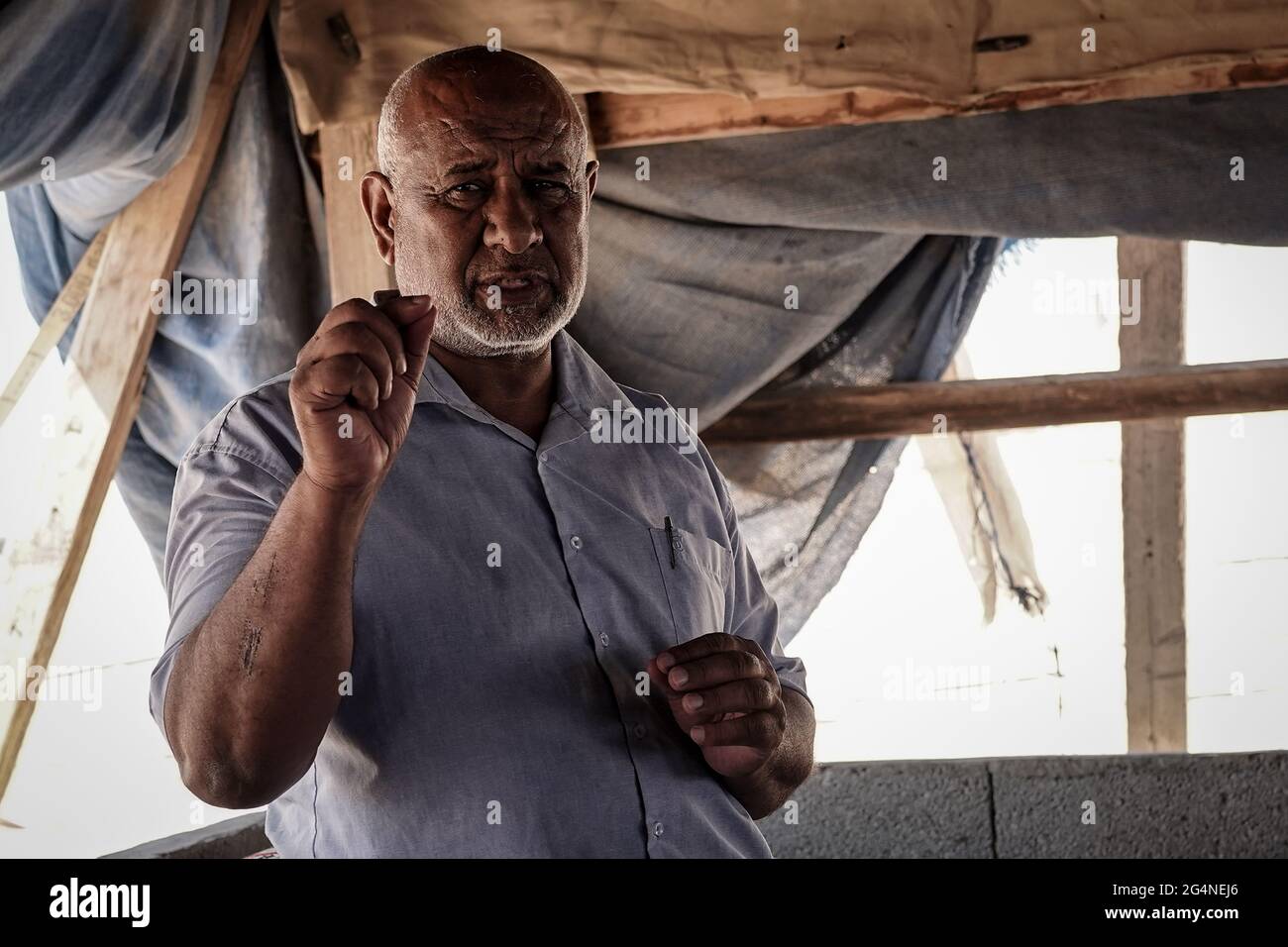 Bir Hadaj, Israel. 22nd, June 2021. ATIEH AL ASAM, Head of the regional Council of the unrecognized villages in the Negev, explains the uncertain future and threat of eviction under which Bedouins live in the unrecognized villages and home demolitions in the legal townships of illegal building. The decades long political battle for the unrecognized Bedouin villages and development of those already legalized in the Israeli Negev climaxes as the new Bennett - Lapid unity government depends on supporting votes from the four Knesset seats belonging to the Raam, United Arab List. Credit: Nir Alon/A Stock Photo