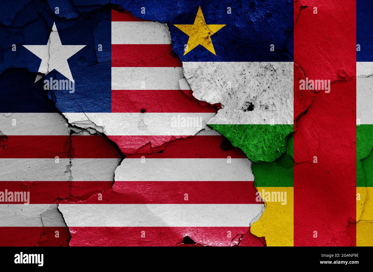 flags of Liberia and Central African Republic painted on cracked wall Stock Photo