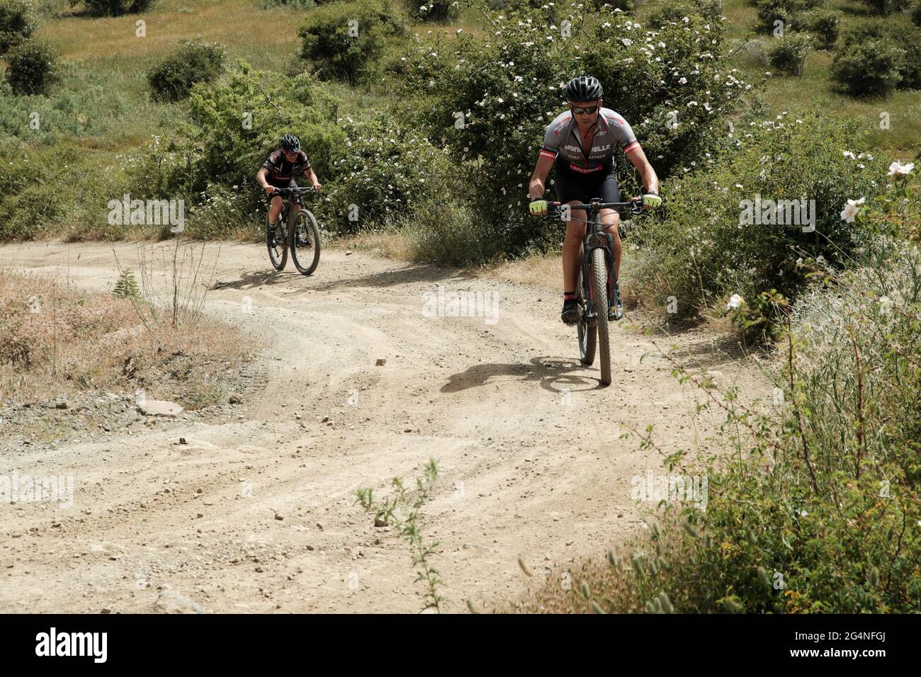 outdoor recreation in Sicily nature bikers riding along a mountain path of nebrodi Park Stock Photo