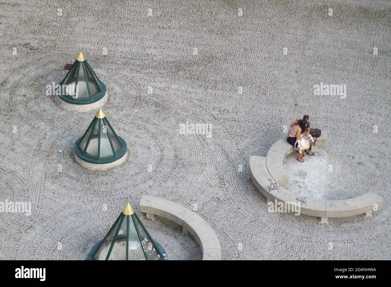 Couple kissing shot with tilt and shift lense making the people