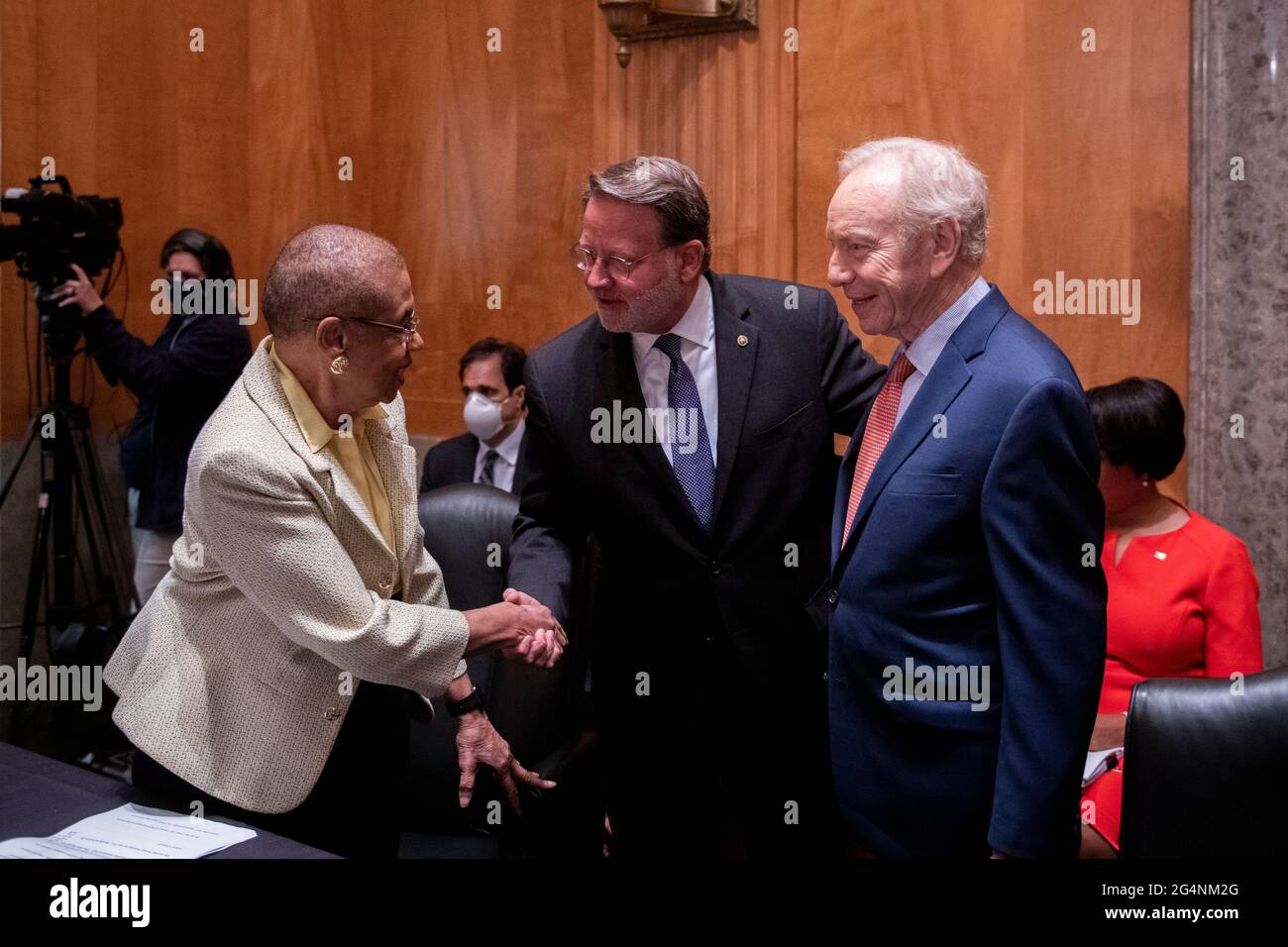 Former United States Senator Joseph I. Lieberman (Independent of Connecticut), right, and Delegate Eleanor Holmes Norton (Democrat of the District of Columbia), left, are greeted by United States Senator Gary Peters (Democrat of Michigan), Chairman, US Senate Committee on Homeland Security and Government Affairs, center, as they arrive for a Senate Committee on Homeland Security and Governmental Affairs hearing to examine D.C. statehood, in the Dirksen Senate Office Building in Washington, DC, Tuesday, June 22, 2021. Credit: Rod Lamkey/CNP /MediaPunch Stock Photo