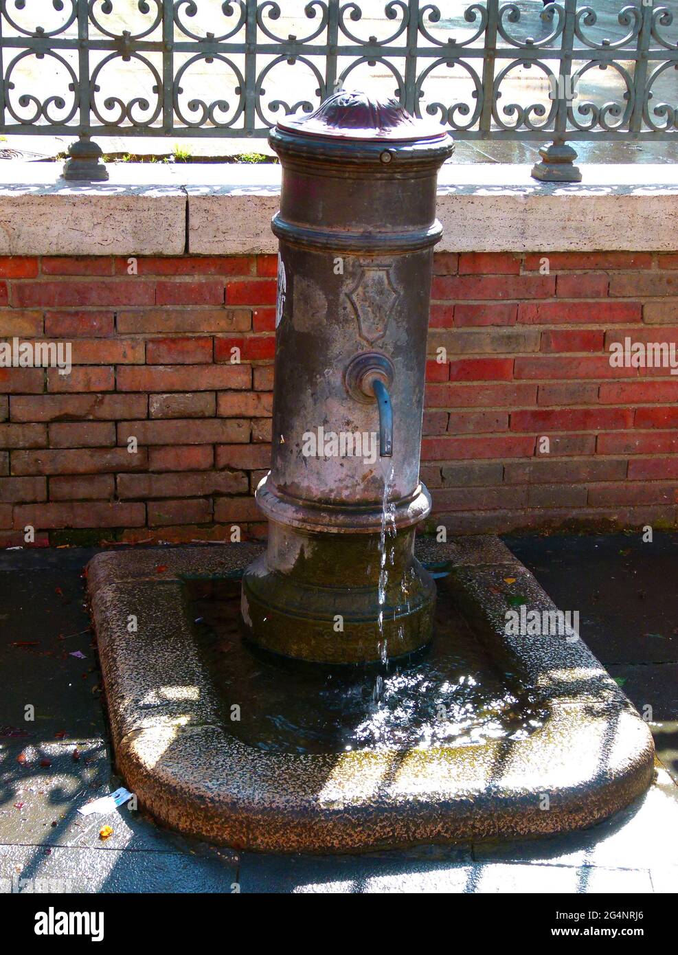 A nasone (large nose) or fontanella (little fountain), is a type of drinking fountain found in Rome, Italy. The design was first introduced in 1870. Stock Photo