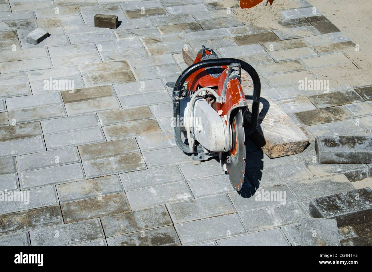 Concrete cutter machinery and cutting on a driveway Stock Photo Alamy