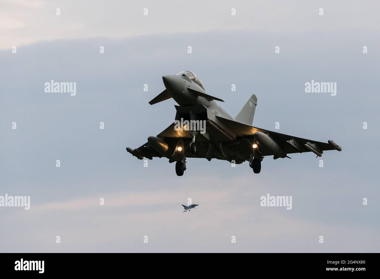 Two Royal Air Force Typhoon jets descend into RAF Coningsby in Lincolnshire during a training sortie in June 2021. Stock Photo