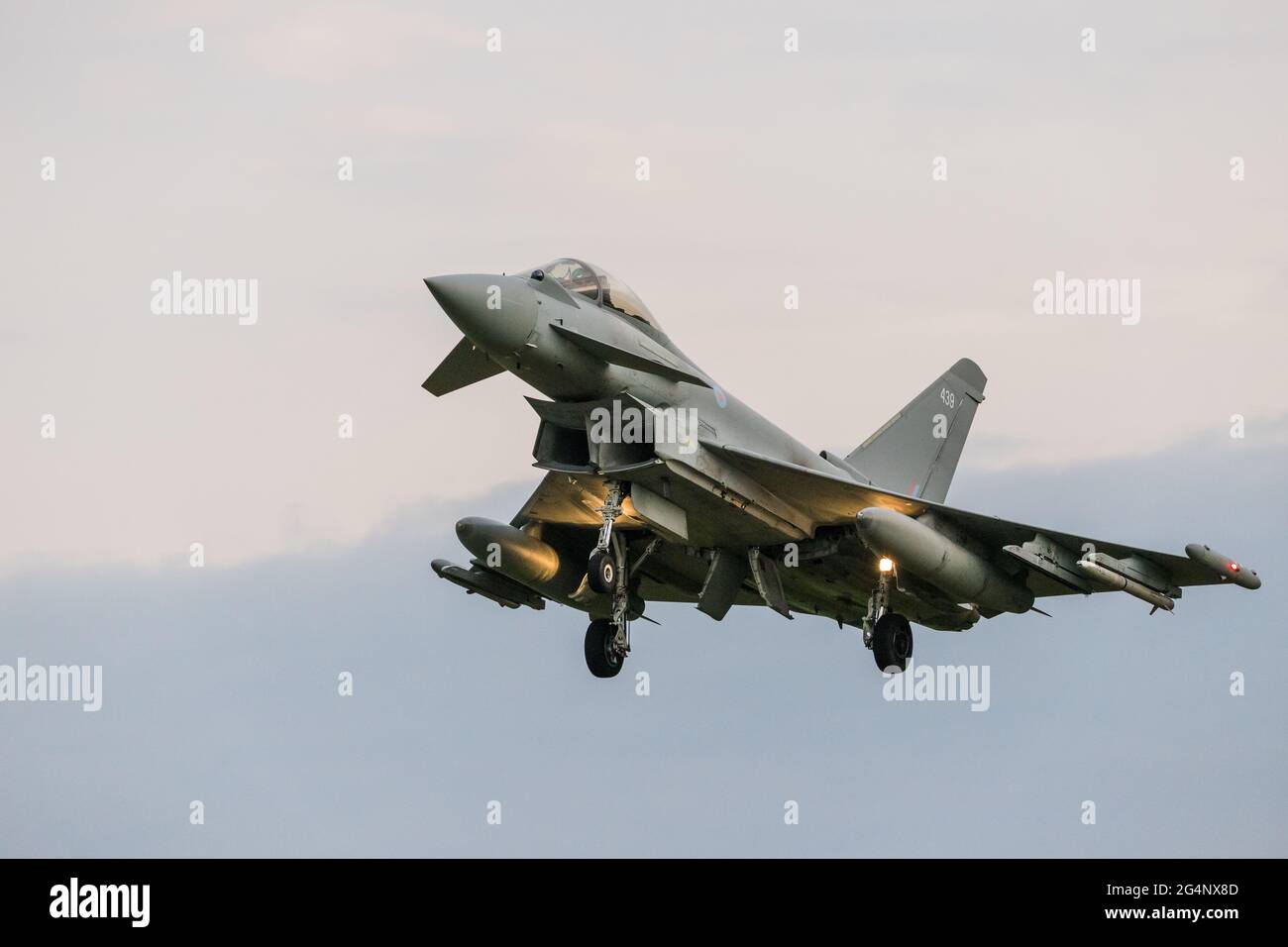 An RAF Eurofighter Typhoon descends into RAF Coningsby in Lincolnshire in June 2021 after a training sortie above the skies of the UK. Stock Photo