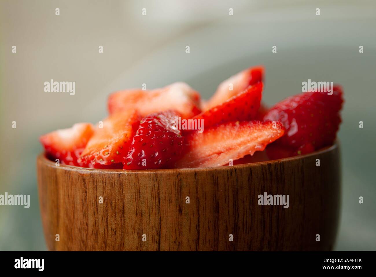 Closeup shot of cut strawberries in the bowl Stock Photo