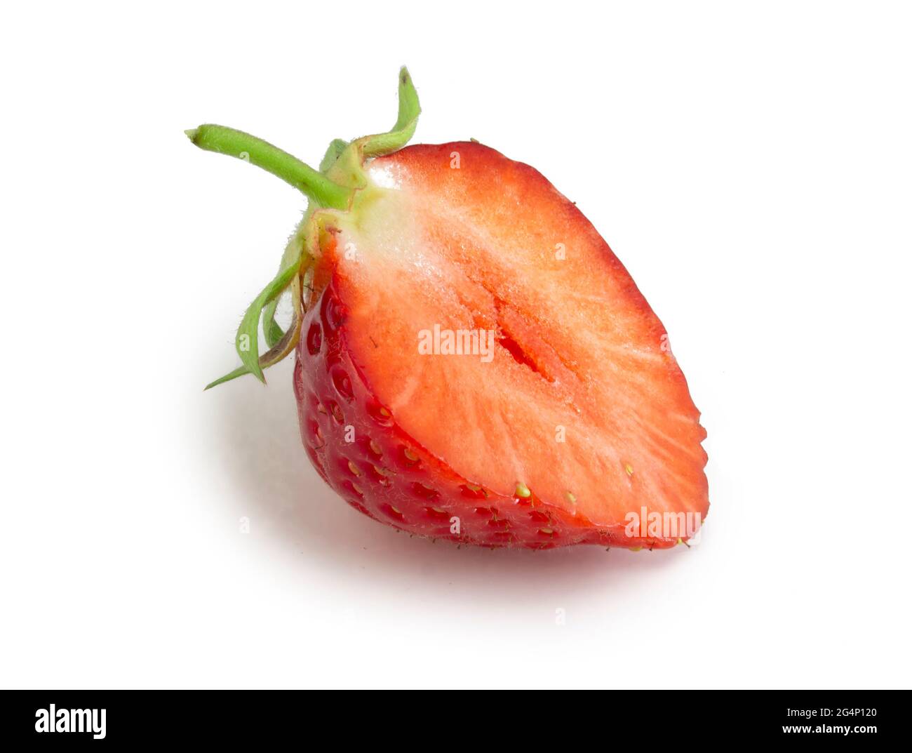 Half of strawberry isolated on white background. Fresh ripe red berry fruit. Stock Photo