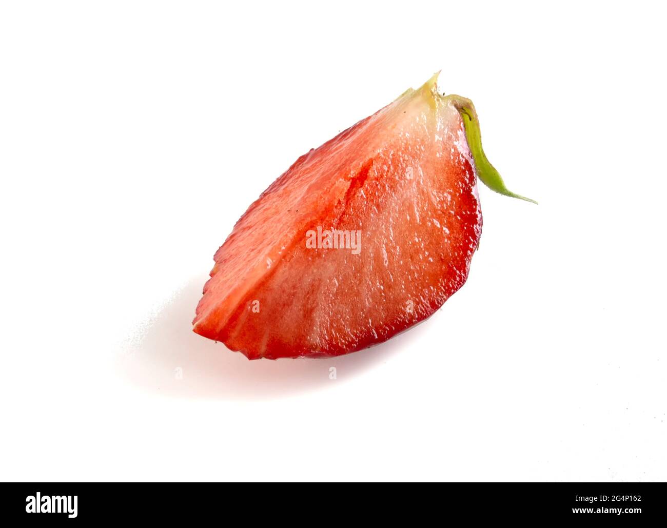 Half of strawberry isolated on white background. A piece of ripe tasty berry. Stock Photo