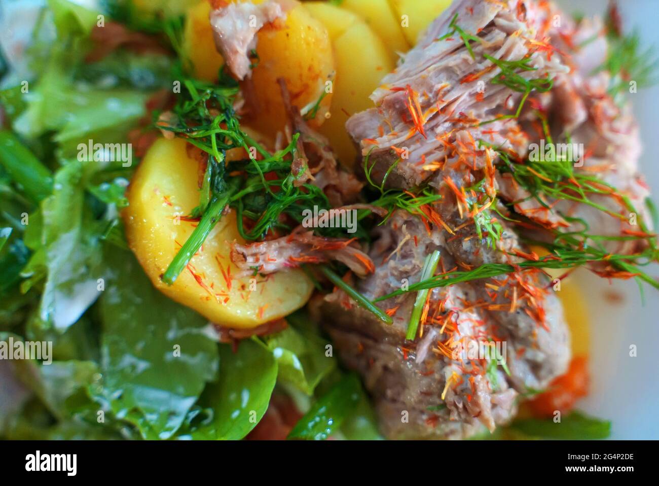 Pulled pork with salad and potatoes. Stock Photo