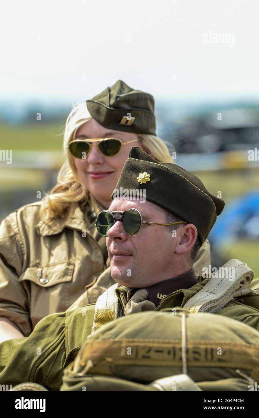 Female and male re-enactors in Second World War American military costume. Period wartime dress Stock Photo