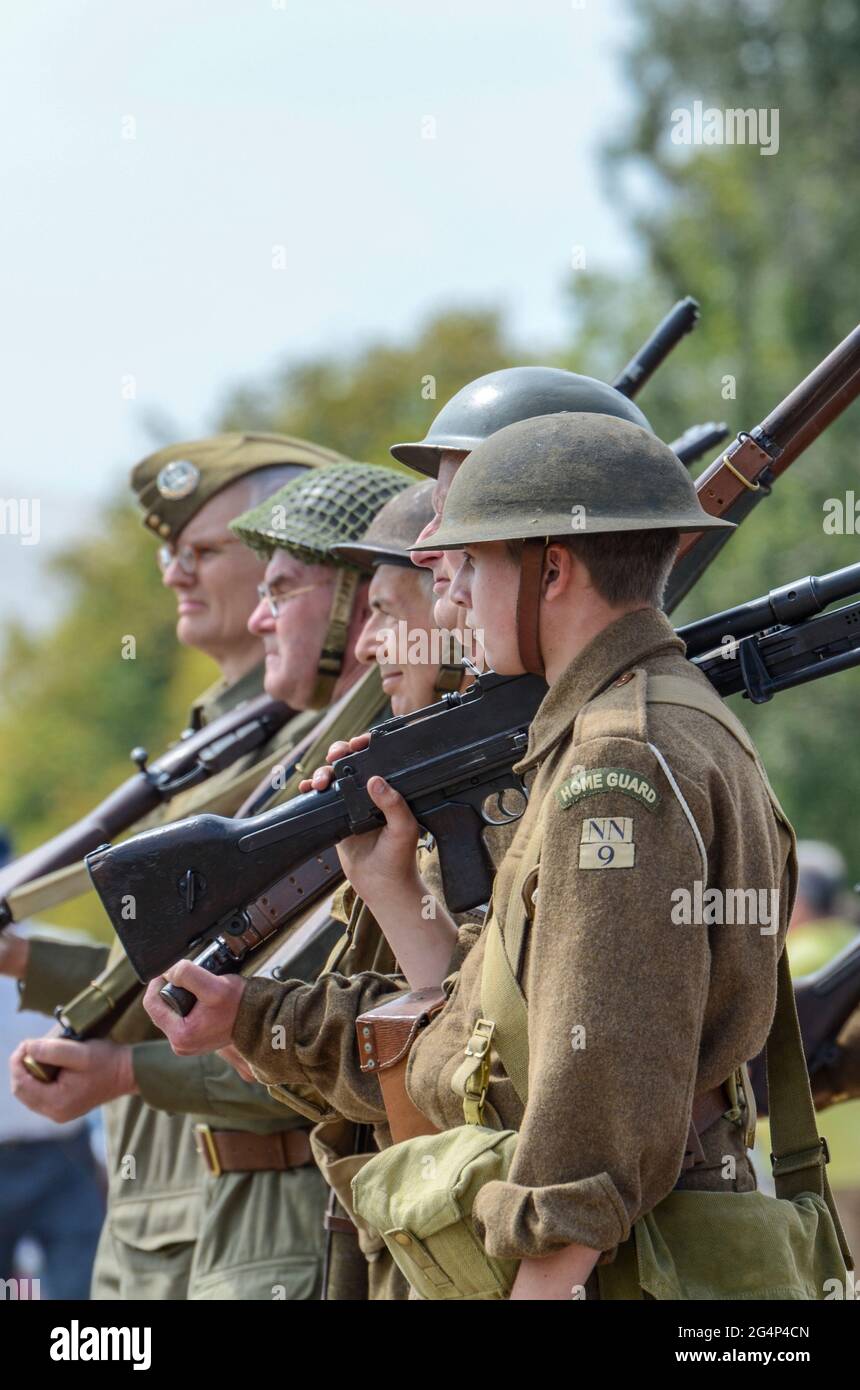 Dad's Army Home Guard re-enactors carrying out a parade at an outdoor event. Uniforms and characters based on the BBC comedy series Stock Photo