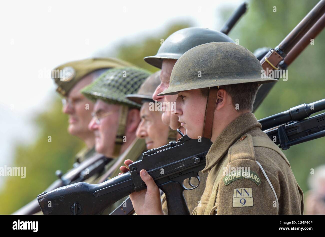 Dad's Army Home Guard re-enactors carrying out a parade at an outdoor event. Uniforms and characters based on the BBC comedy series Stock Photo