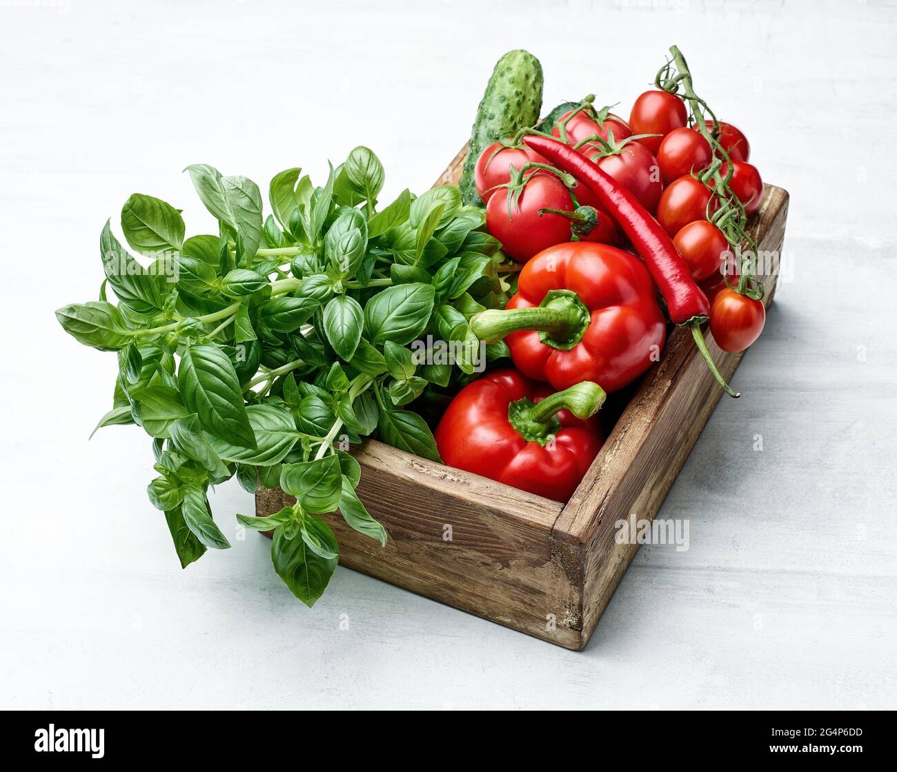 fresh raw vegetables in wooden box Stock Photo