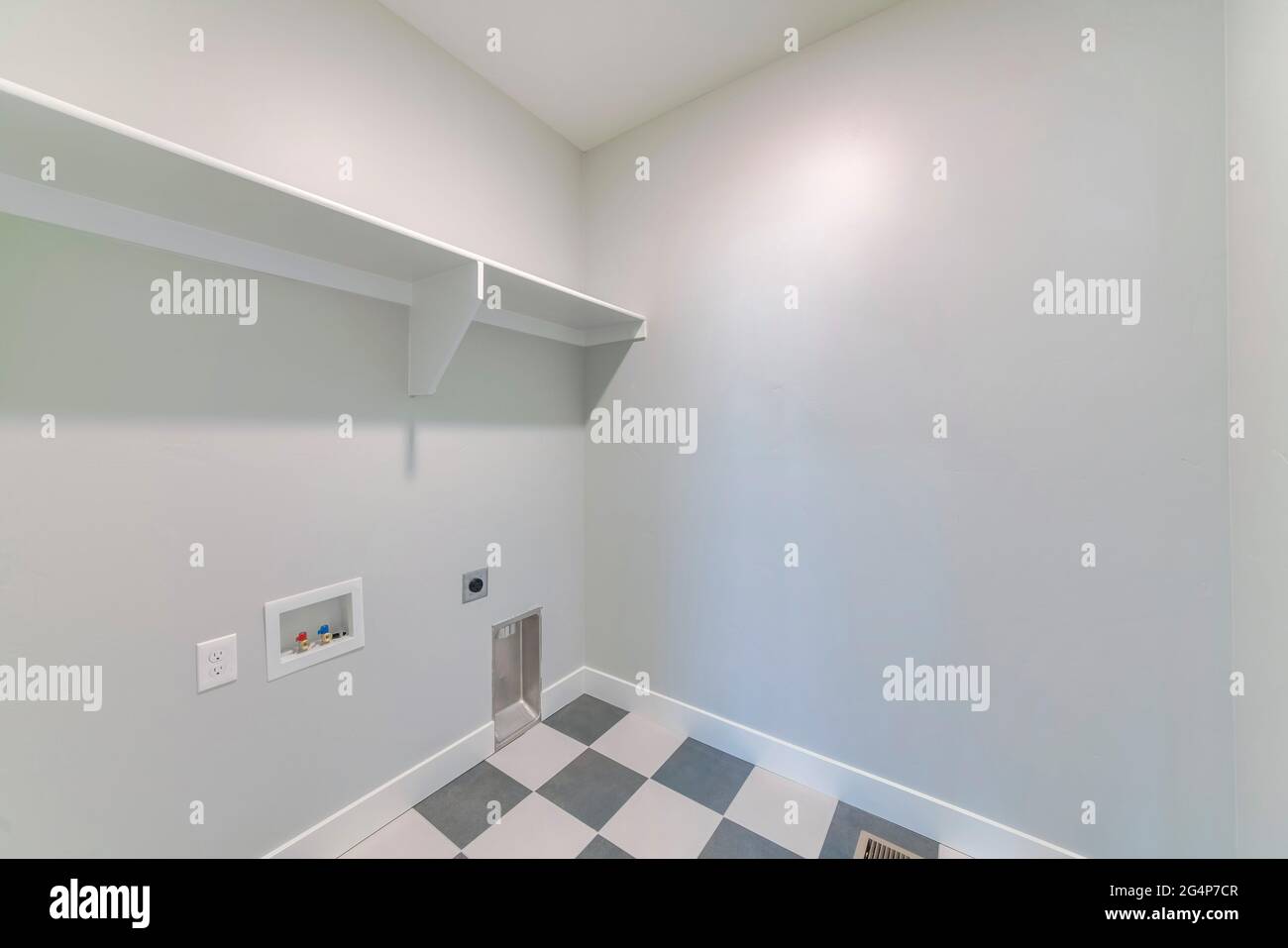Image showcasing The white wooden shelves in a laundry room Stock Photo - Alamy